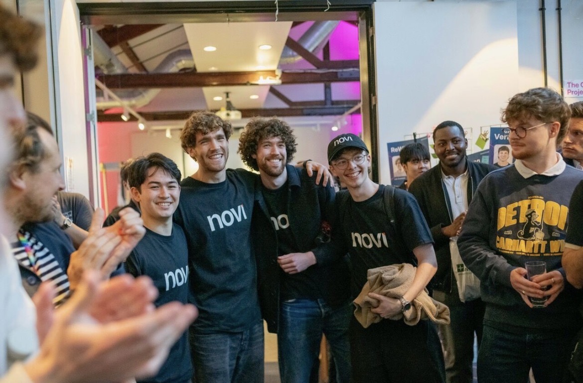 Four Novi team members together at an event